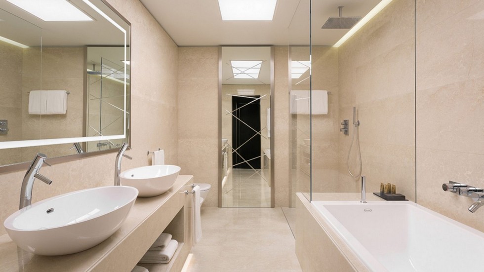 Discover the stunning bathroom of our Excelsior Room, an exquisite balance of marble and white ceramic.