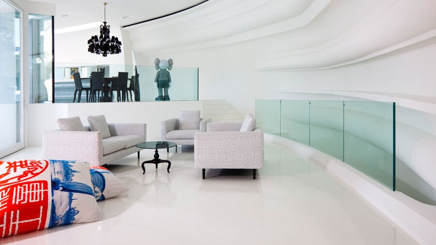 Marcel Wanders design this exquisite open space, where the centerpiece is a bold red sofa.