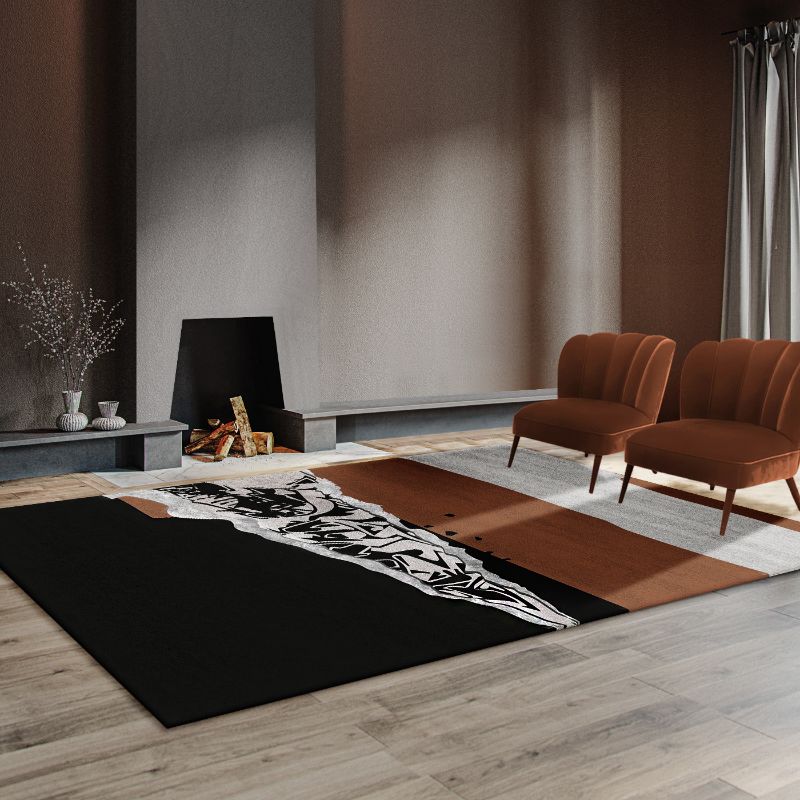 minimalist living room with a black and brown rug