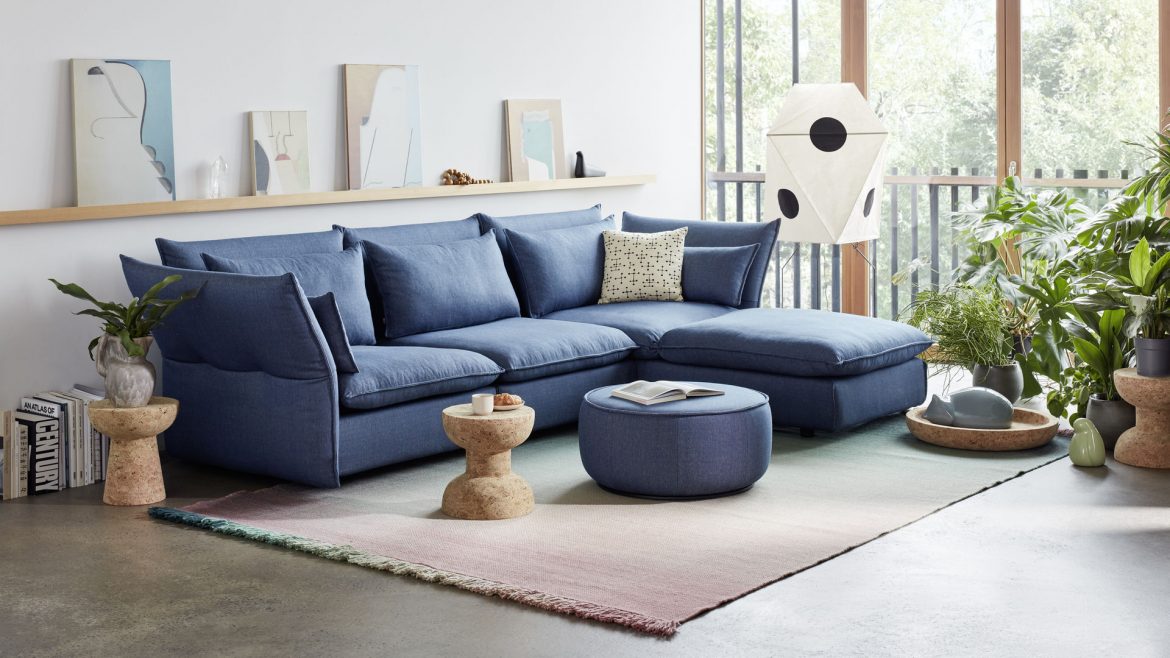 light toned living room with blue sofa