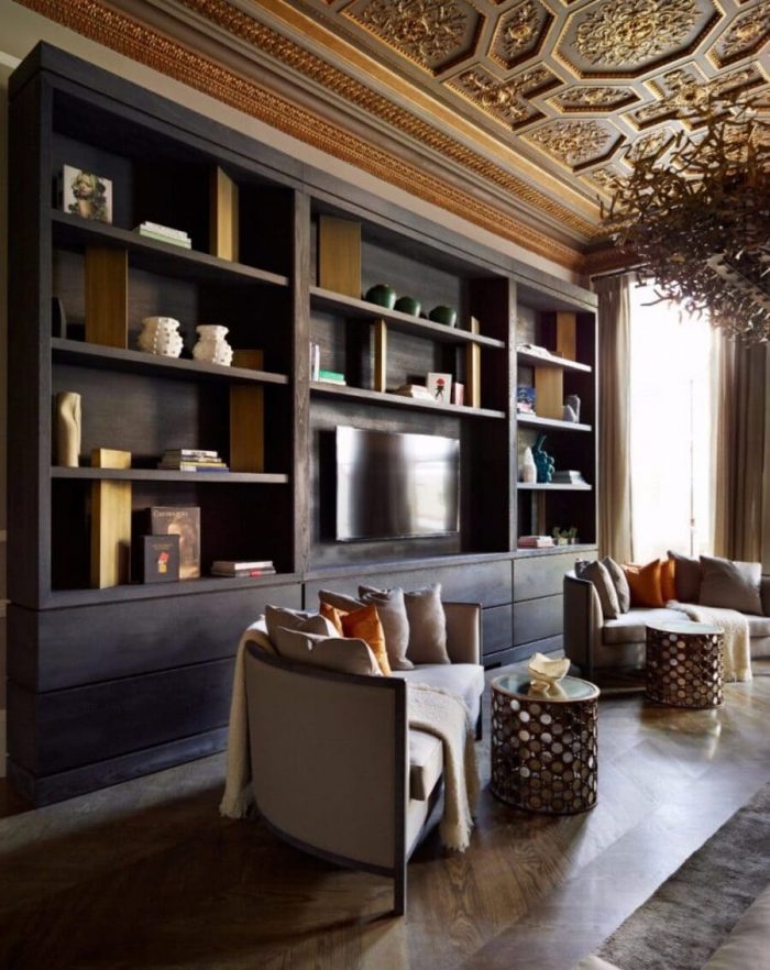 A living room idea with yellow and brown tones with stunning luxury furniture pieces by Fiona Barrat!